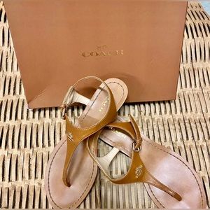 Coach  one inches wedge sandals. Tan color very comfortable used 2-3 times .